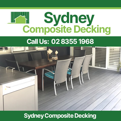 Modern outdoor dining area with grey composite decking and furniture in Sydney backyard